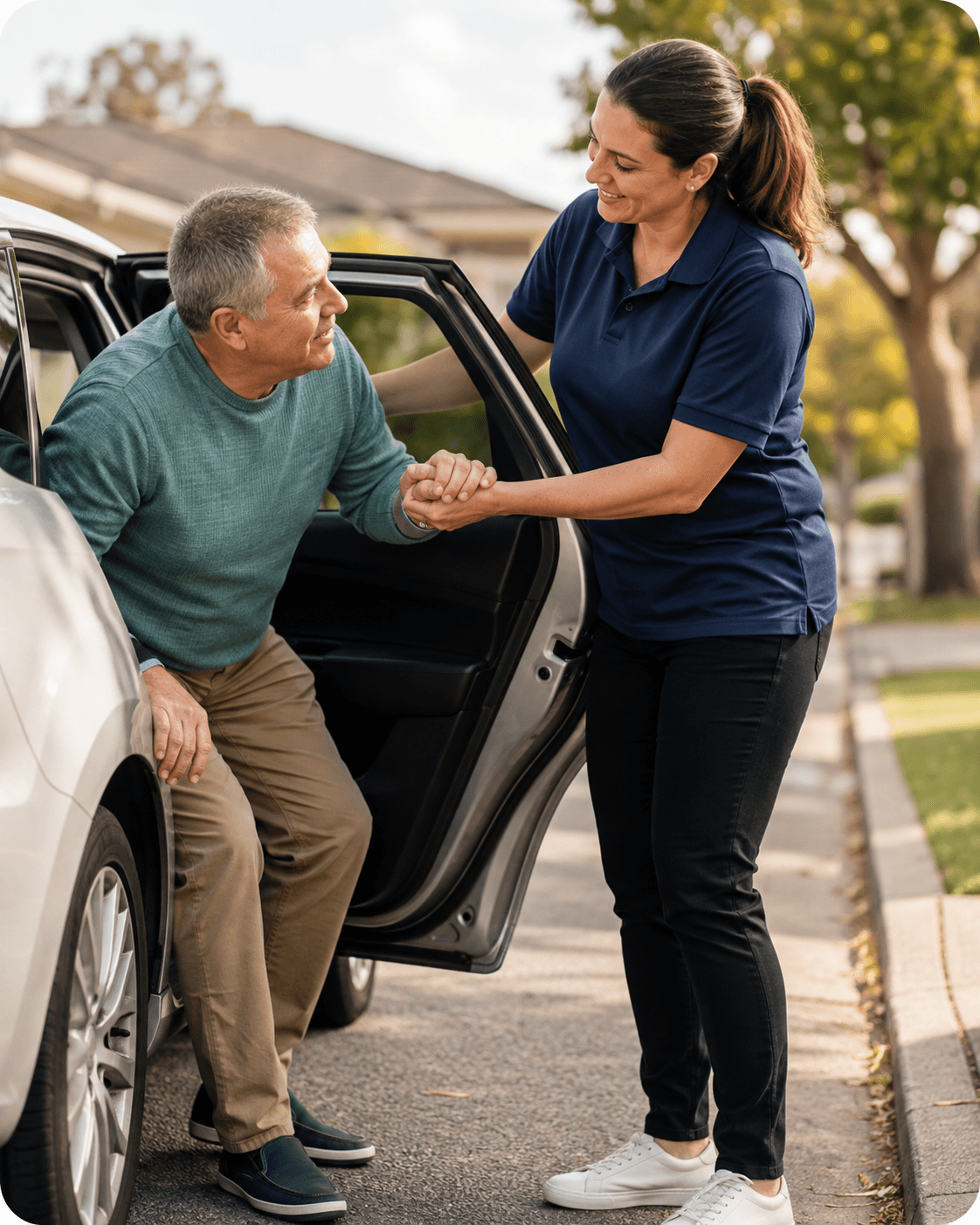 A support worker helping a participant get into a car